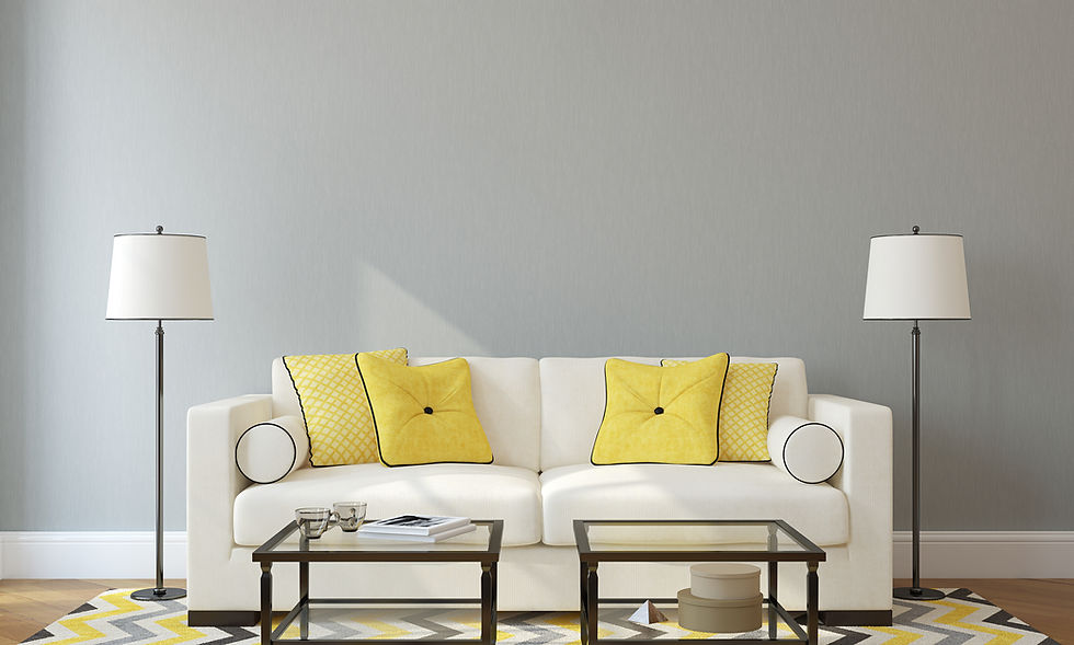 Image of a grey painted living room with a sofa and lamps