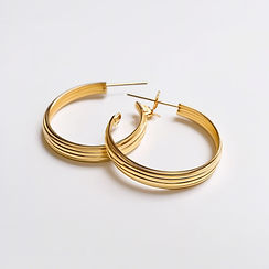 gold hoop earings white background.jpg