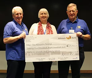 TAB trustee Dick Richards presents a TAB Certificate of Appreciation to Natalie Berkeley of Infineum who raised £900 through sponsorship for TAB by running the Coventry half marathon.