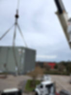 crane lifting an Air conditioner