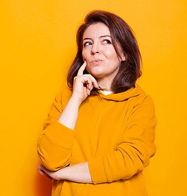 caucasian-woman-thinking-with-hand-chin-camera-studio-thoughtful-person-feeling-confused-w