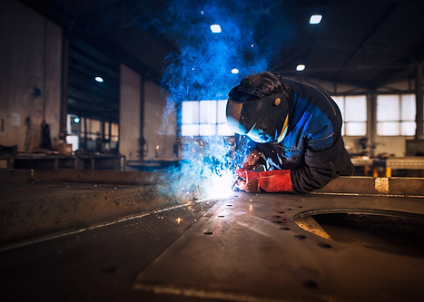 close-up-view-worker-welding-metal-construction-industrial-workshop.jpg