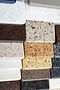 layout-colorful-specimens-granite-marble-quartz-natural-stone-slabs-close-up-stone-kitchen