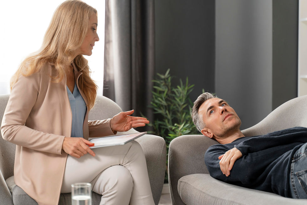 mid-shot-man-laying-couch-therapy-cabinet-near-woman-counselor.jpg
