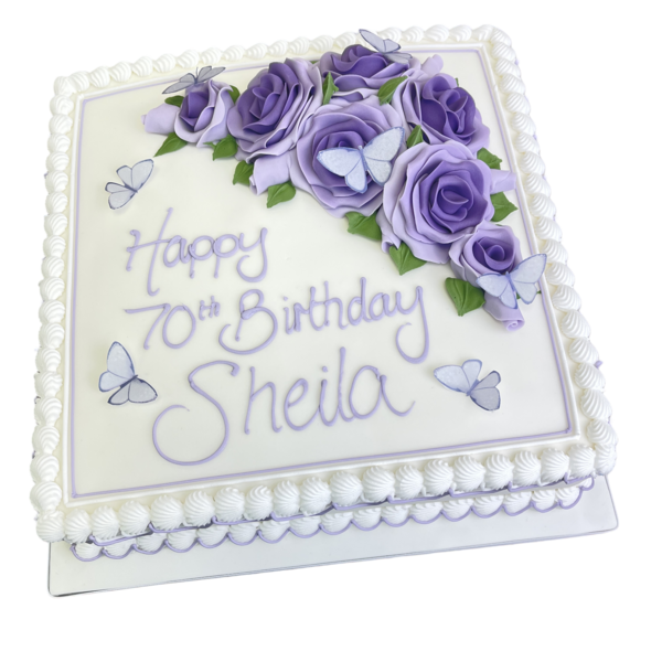 Bespoke celebration cake in Solihull, West Midlands with detailed pink roses and colorful butterflies decoration.