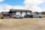 Citygate Electric headquarters building with service trucks for electrician jobs - Hamlin, NY