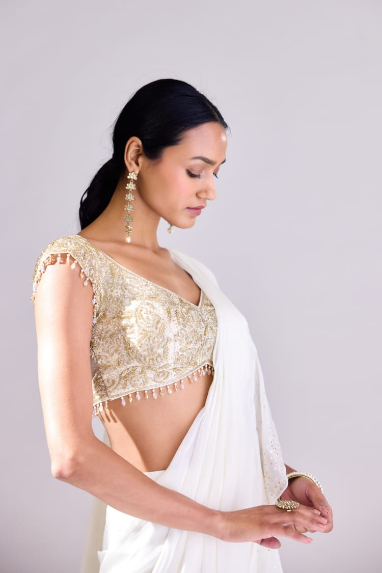 vory pre-stitched saree with gold hand embroidered blouse and crystal tassels – front view