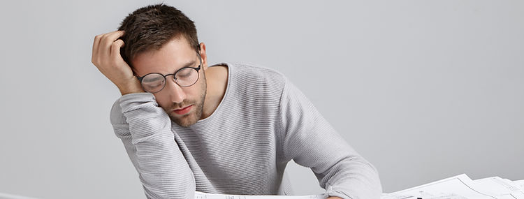 tired-young-attractive-man-sleeps-work-place-has-much-work-being-fatigue-exhausted.jpg
