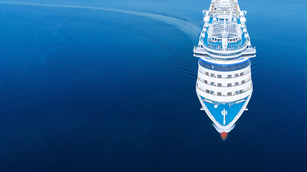 Aerial Shot of Large Ocean Cruise Ship Sailing, Bow, Blue Water.jpeg
