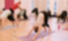 Alonso Seixas teaching yoga at the Oval (Reay Primary) and helping students with postures