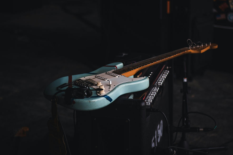 Light blue Fender Stratocaster guitar on 5150 amplifier on stage
