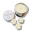 Thumbnail: Light blue 125mls soy wax candle in a silver tin labelled Whispering Woofs, with three light blue paw shaped wax melts