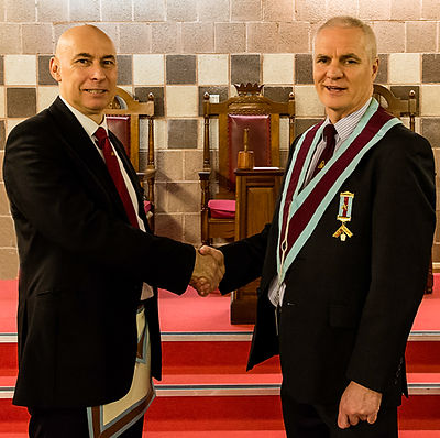Installing Officer, Bro. Simon Lusty congratulates V.W.M. Gary Spiers after his installation.