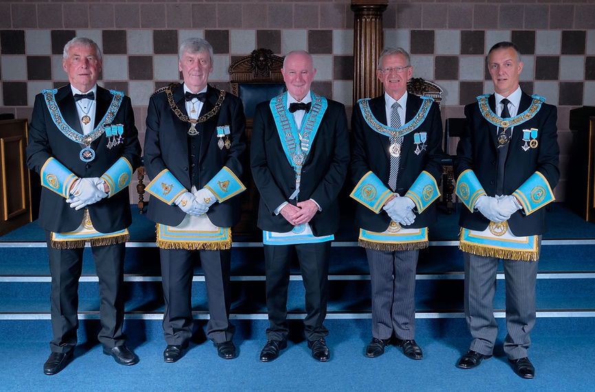 Worshipful Master, W.Bro. Lee Burnside accompanied by the Deputy Grand Master, R.W.Bro. Rodney L. McCurley, Provincial Grand Master of Antrim, R.W. Bro. J. McLernon, Provincial Deputy Grand Master of Londonderry and Donegal, R.W.Bro. Kenneth Doherty, Provincial Assistant Grand Master of Londonderry and Donegal, R.W.Bro. Grahame Harper, Wardens, and Officers of the Lodge.