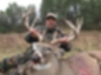 Close-up of hunter with whitetail buck - private ranch success