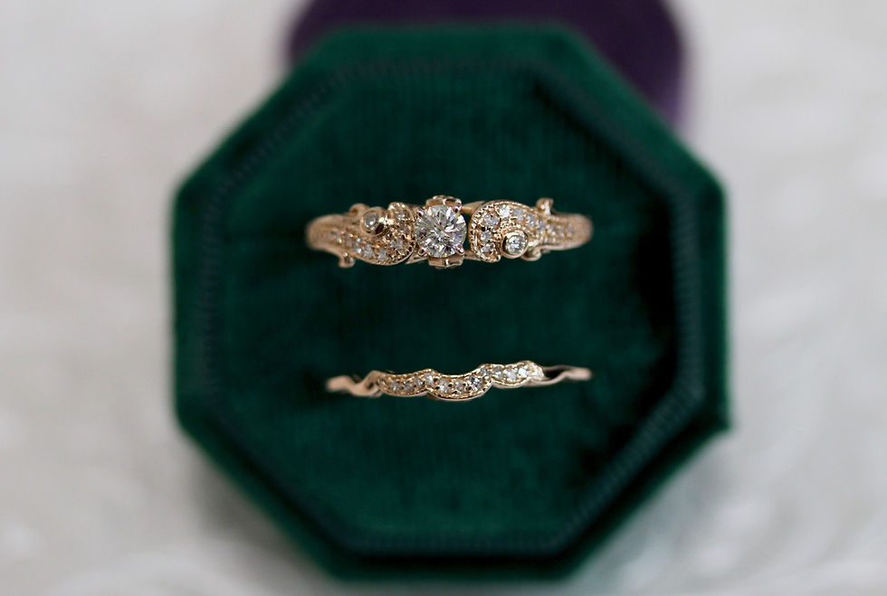 Yellow gold diamond bridal set displayed in green velvet box