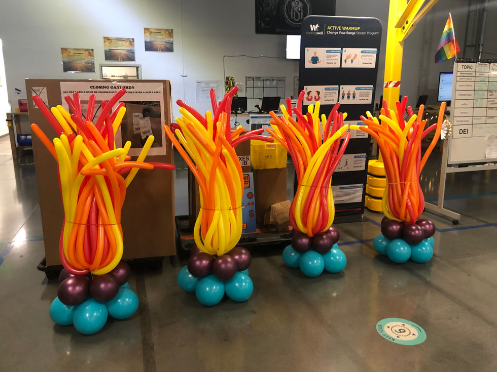 balloons are displayed in front of a sign that says active warmup