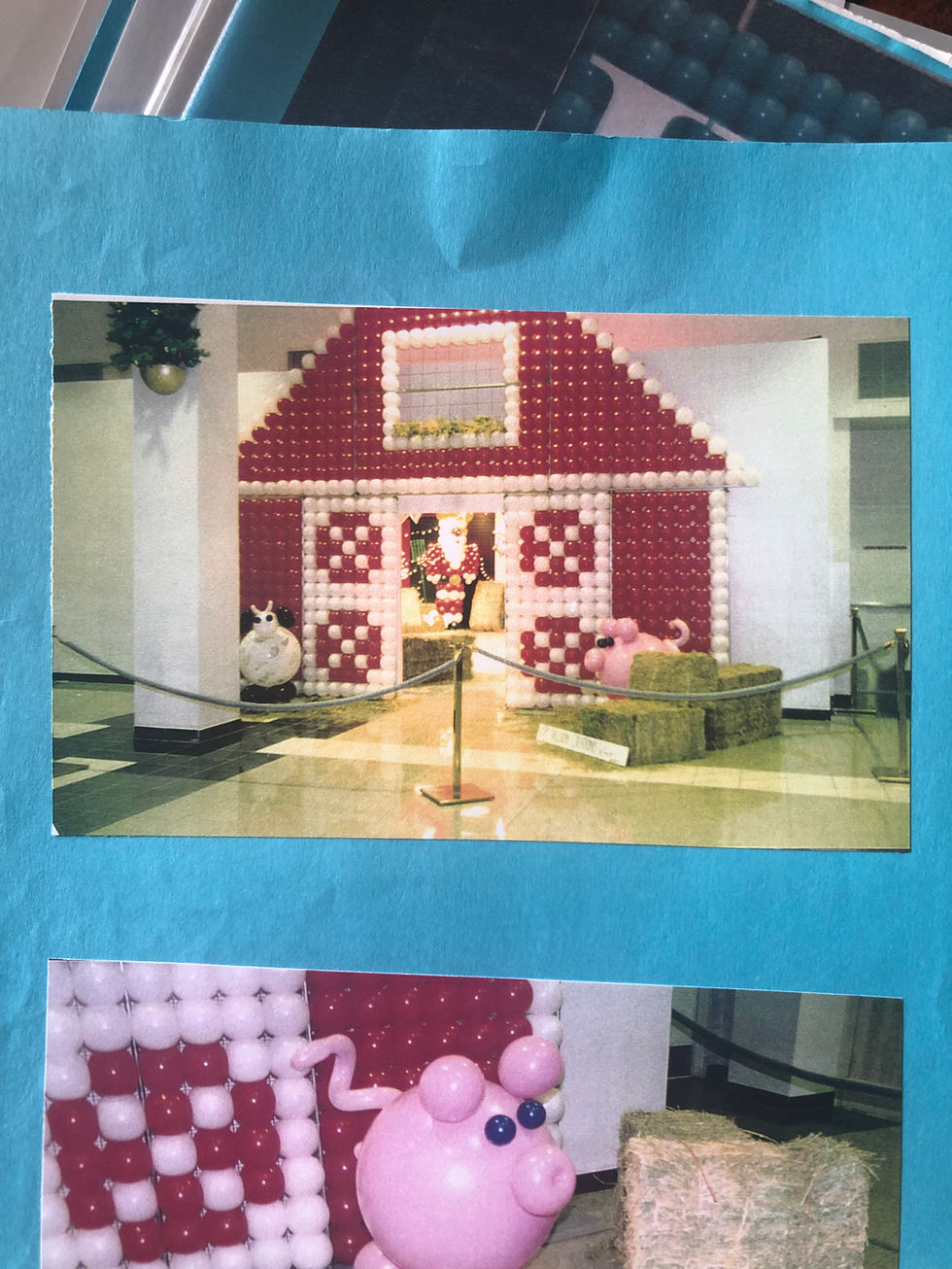 a picture of a barn made out of balloons