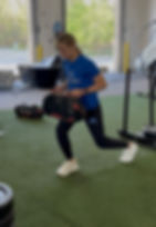 Eye-level view of a young athlete sprinting on a track at FAST Athletics facility