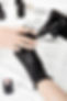 nail-artist-gloves-applying-base-coat-ring-finger.jpeg