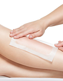 woman-depilating-her-legs-by-waxing.jpg