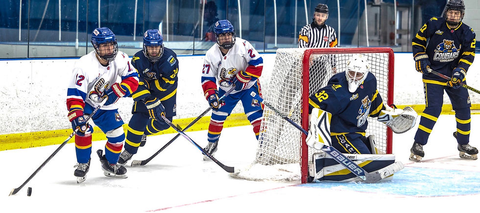 #12 Forward Brandon Adolfino and #27 Forward Blake Adolfino work behind their rivals net | Photo by Beverly Buchinger