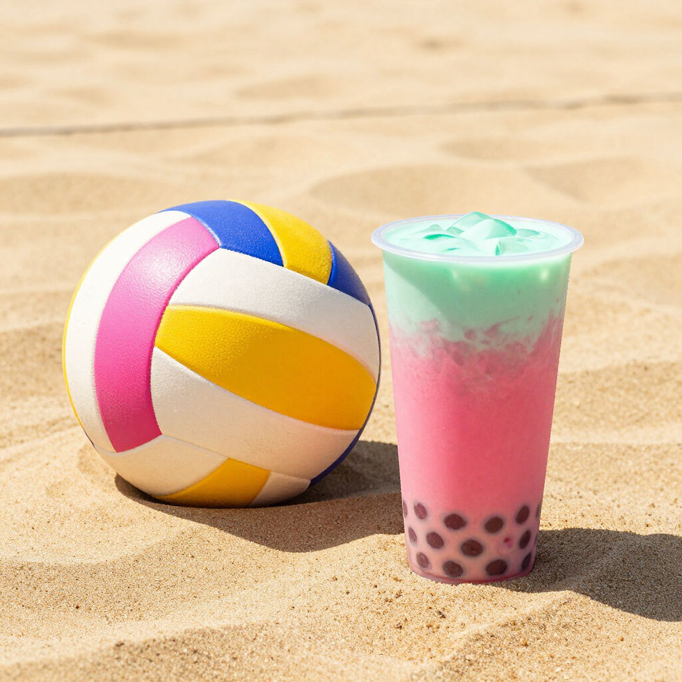 Colorful beach volleyball and layered drink on sand