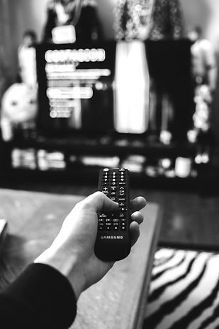 person holding black remote control_edited.jpg