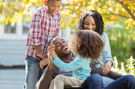 Family playing on lawn