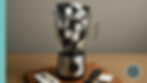 Blender filled with mini black and white electronic devices, notebooks, and pens. Set on a wooden surface with a notebook and phone beside.