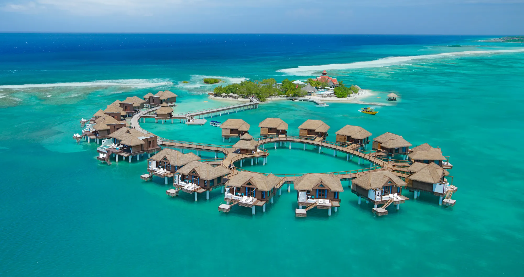 Beach/ocean cabana hotel, coastal luxury, waterfront relaxation, oceanfront accommodation, tropical paradise, seaside comfort, panoramic views, private cabanas, beachside getaway, tranquil escape, coastal retreat, honeymoon destination, romantic vacation.