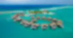 Beach/ocean cabana hotel, coastal luxury, waterfront relaxation, oceanfront accommodation, tropical paradise, seaside comfort, panoramic views, private cabanas, beachside getaway, tranquil escape, coastal retreat, honeymoon destination, romantic vacation.