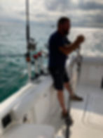 lake ontario fishing charters man holding fish on lake ontario
