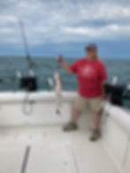 lake ontario fishing charters woman in red shirt holding fish
