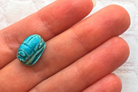 While holding a scarab, renew your career