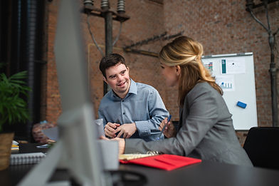 down-syndrome-man-with-businesswoman-colleague-wor-2022-01-19-00-04-10-utc.jpg