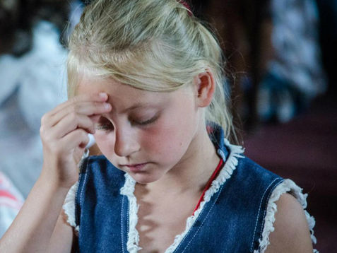 What is the meaning of the sign of the Cross?