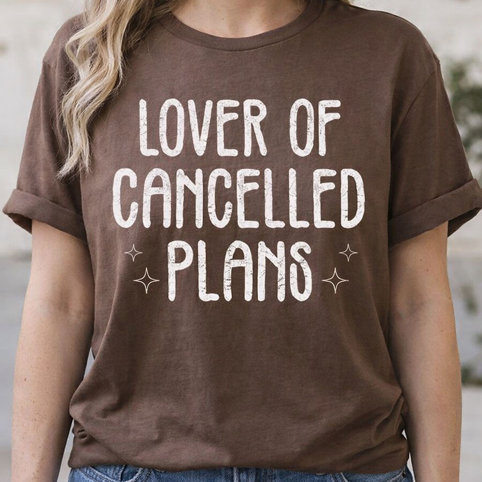 Brown t-shirt with "LOVER OF CANCELLED PLANS" text and stars.