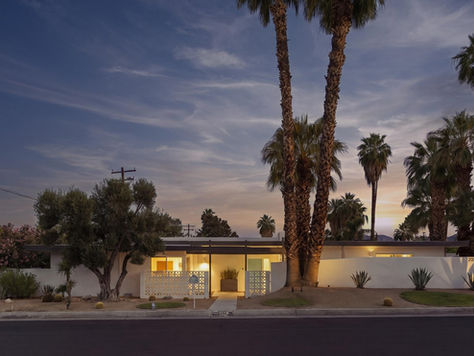 Front exterior view of 45930 Panorama Drive, a mid-century modern residence for sale on a corner lot in South Palm Desert, CA 92260, featuring clean architectural lines, desert landscaping, and a backdrop of the San Jacinto Mountains.