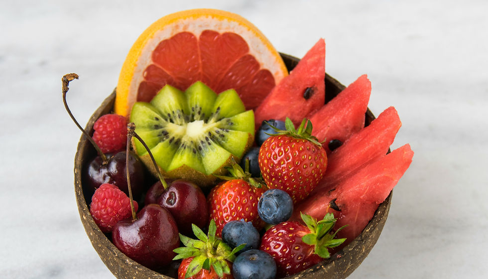 Close-up view of a bowl of fresh watermelon cubes on a wooden table