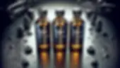 DALL·E 2024-03-26 21.44.04 - Visualize a trio of elegant 30 ml bottles, precisely arranged