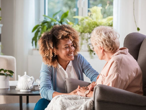 A support worker talking to resident