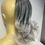 Thumbnail: Mixed salt and pepper to silver ends claw clip in ponytail 