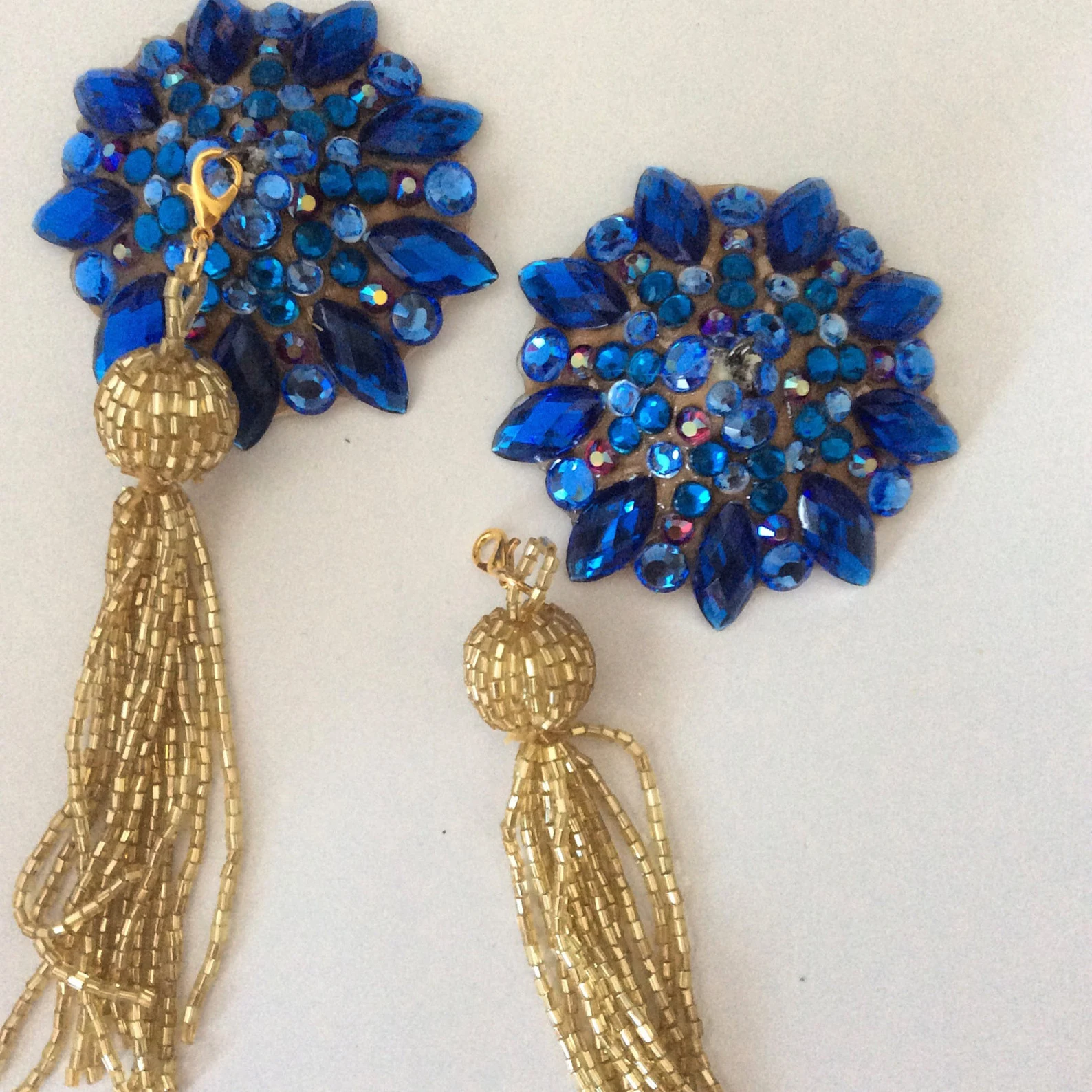 Sapphire, capri blue pasties on nude base with removable gold beaded tassel