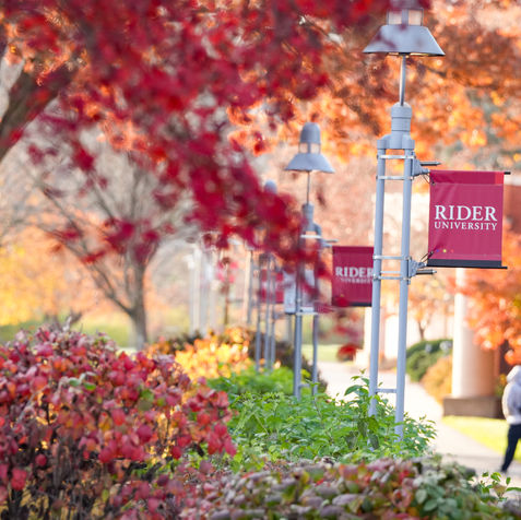 Image of Rider University banners on campus in the autumn