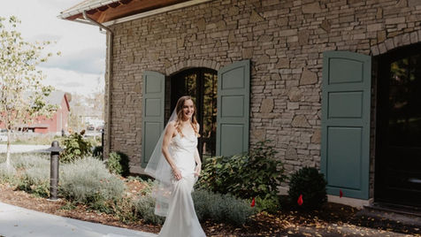 bride walking the grounds at mirbeau inn & spa