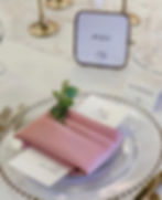 Mauve Dusty Rose poly napkin folded on glass charger plate rental near me in Michigan