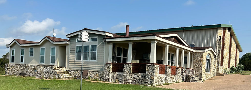 Eye-level view of a cozy living room with a fireplace and comfortable furniture