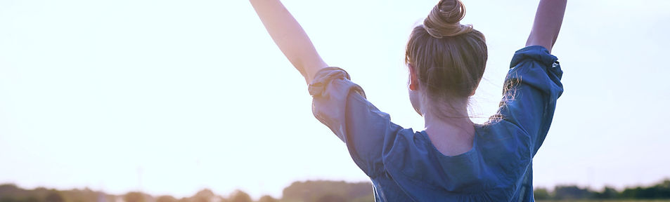 woman feeling free arms stretched