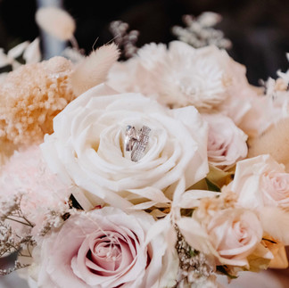 bridal bouquet with wedding rings